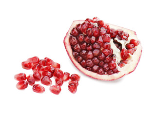 Part of pomegranate fruit isolated on white background. Closeup.