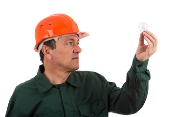 old man electrician in uniform with bulb. Isolated on white