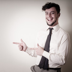 stylish modern guy with white shirt pointing