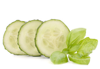 Sliced cucumber vegetable and basil leaves still life