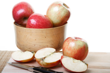Whole and Cut Apples on Board