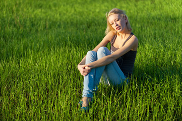 Portrait of the young beautiful blond woman outdoors
