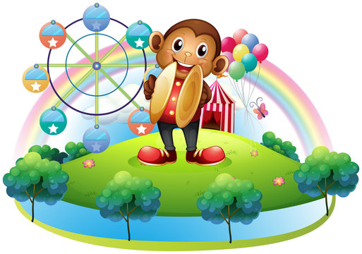 A monkey with a ferris wheel and balloons at the back