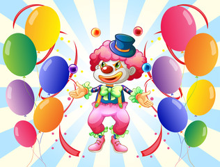 A clown with a colorful costume surrounded by balloons