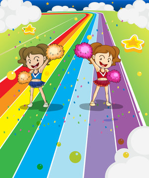Two young cheerleaders dancing at the colorful road