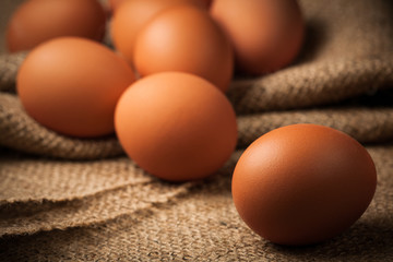 many eggs on burlap background