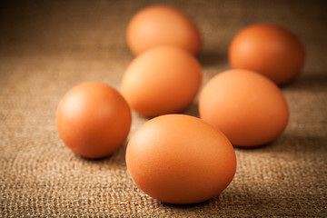many eggs on burlap background