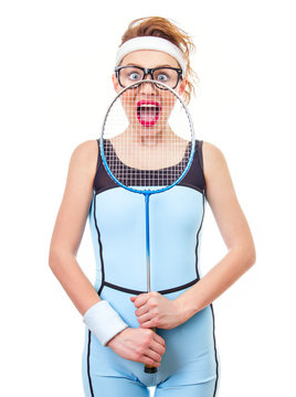 Surprised funny fit woman playing with recket