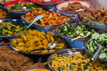 Rolgordijnen Buffet with asian food at a market © efmukel