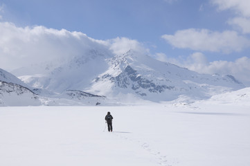Fototapeta na wymiar A lone hiker in the snow, Mont Cenis ( France ).