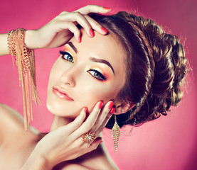 Model with Coral makeup and manicure