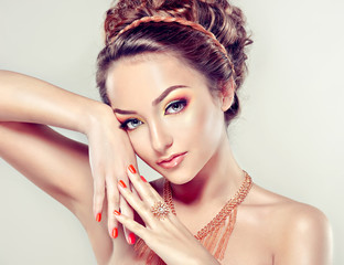 Model with Coral makeup and manicure