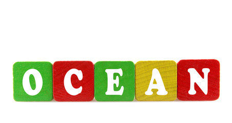 ocean - isolated text in wooden building blocks