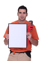 handyman showing a little white panel