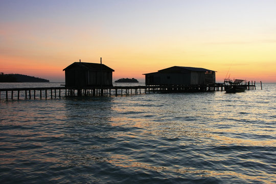 Silhouette of wooden jetty at sunrise, Koh Rong island, Cambodia