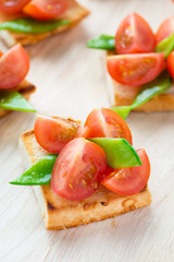 Bruschetta with fresh tomato and snow peas
