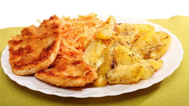 Fried chicken roasted potatos and carrot salad