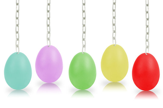 Colorful eggs hanging by chains isolated on the white background