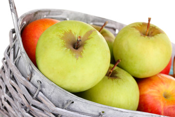 Ripe apples in basket close-up
