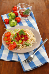 Tasty spaghetti with sauce and vegetables