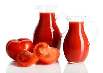 Fototapeta na wymiar Tomato juice in pitchers isolated on white