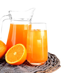 Glass and pitcher of orange juice isolated on white
