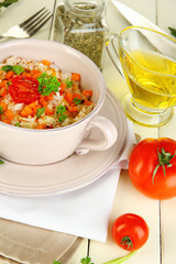 Delicious rice with vegetables and herbs in pot