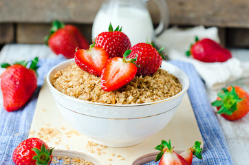 Cereal with strawberries . Breakfast.