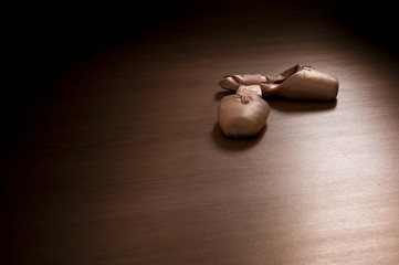 Pointe shoes on wooden floor