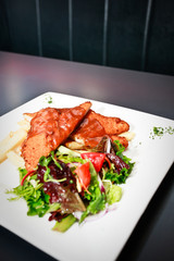 Healthy meal of chicken and salads