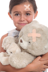 Little girl and teddy bear injured