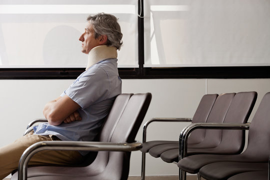 Man With Neck Injury Waiting In Lobby