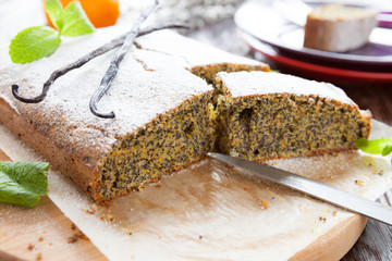 poppy seed cake with powdered sugar in a cut
