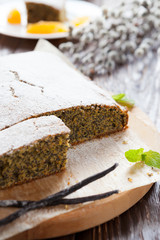 poppy seed cake with powdered sugar on top