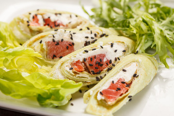 tasty appetizer with salmon and cheese
