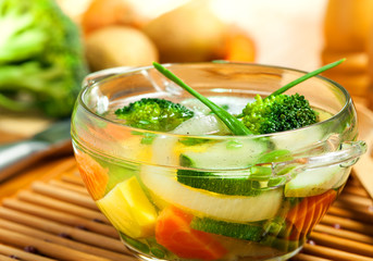 Vegetable soup and ingredients on a table