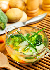 Vegetable soup and ingredients on a table