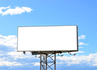 Blank street billboard against blue sky