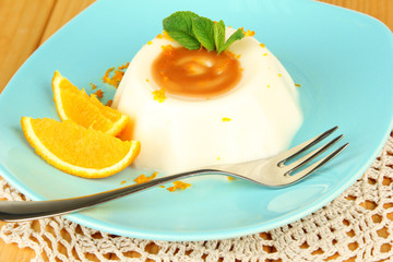 Panna Cotta with orange zest and caramel sauce,