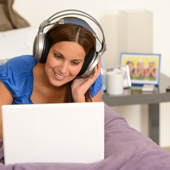 Teenage girl surfing on internet with laptop