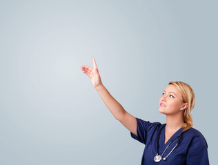 Young female doctor gesturing with copy space