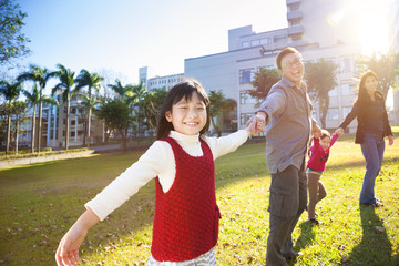 happy  family in the school with sunlight background