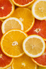 Orange fruit background with lemon and red orange fruits