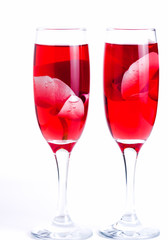 glass with red wine and an orchid