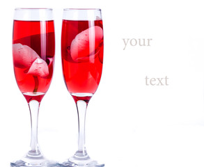 glass with red wine and an orchid