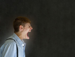 Angry big mouth man shouting on blackboard background