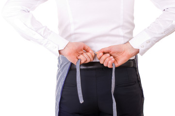 Businessman tying apron strings.