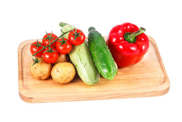 a group of fresh vegetables isolated over white background