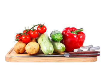 a group of fresh vegetables isolated over white background