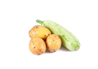 a group of fresh vegetables - potatoes and marrow